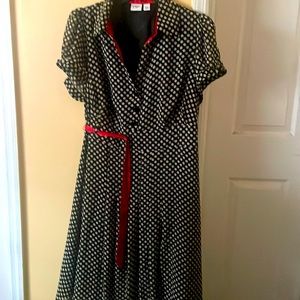 Beige and black polkadot dress accident with a red built very comfortable